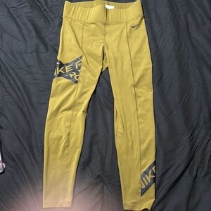 Nike DriFit Women’s Mustard Gold Leggings with Black Accents